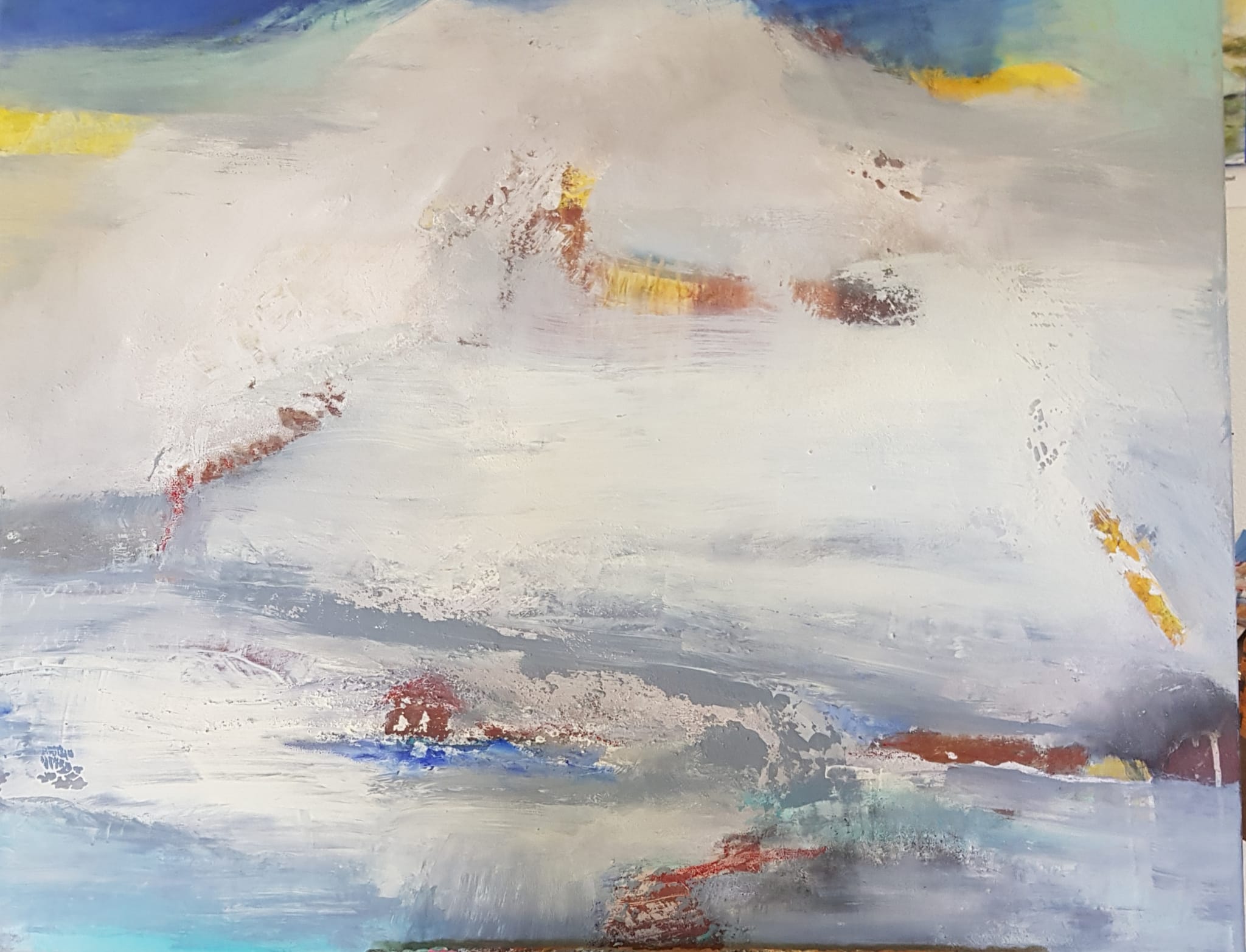 Abstract painting in off-white and grey with rust red, yellow and blue accents